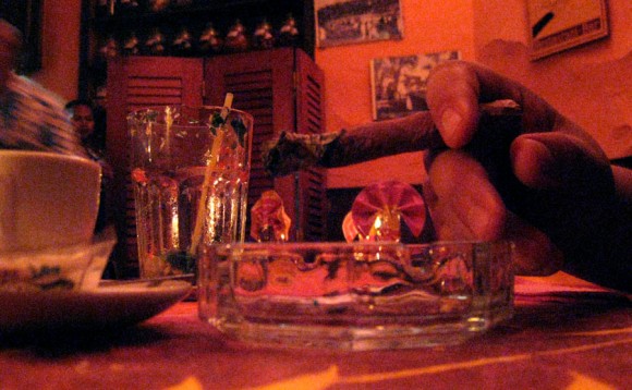 Handrolled local cigar complements a small coffee exquisitely
